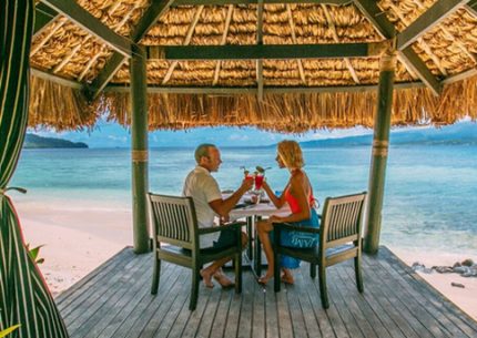 Couple by the beach in Qamea on Romantic Fiji Vacation for two