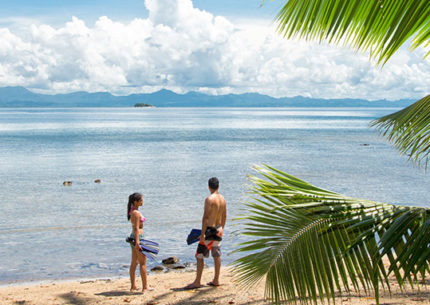 Couple looking out onto the ocean