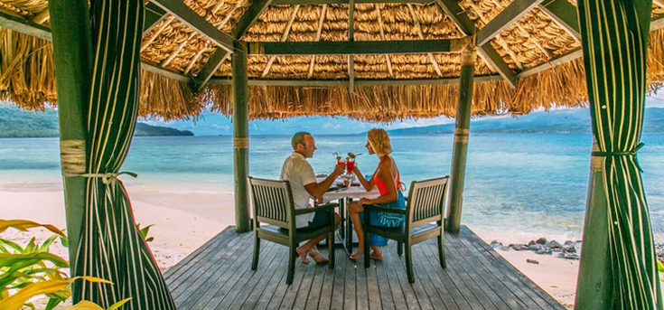 Couple by the beach in Qamea on Romantic Fiji Vacation for two