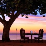 Beachside dining Fiji sunset