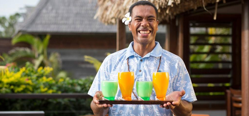 Tropical cocktails served by Fiji resort staff
