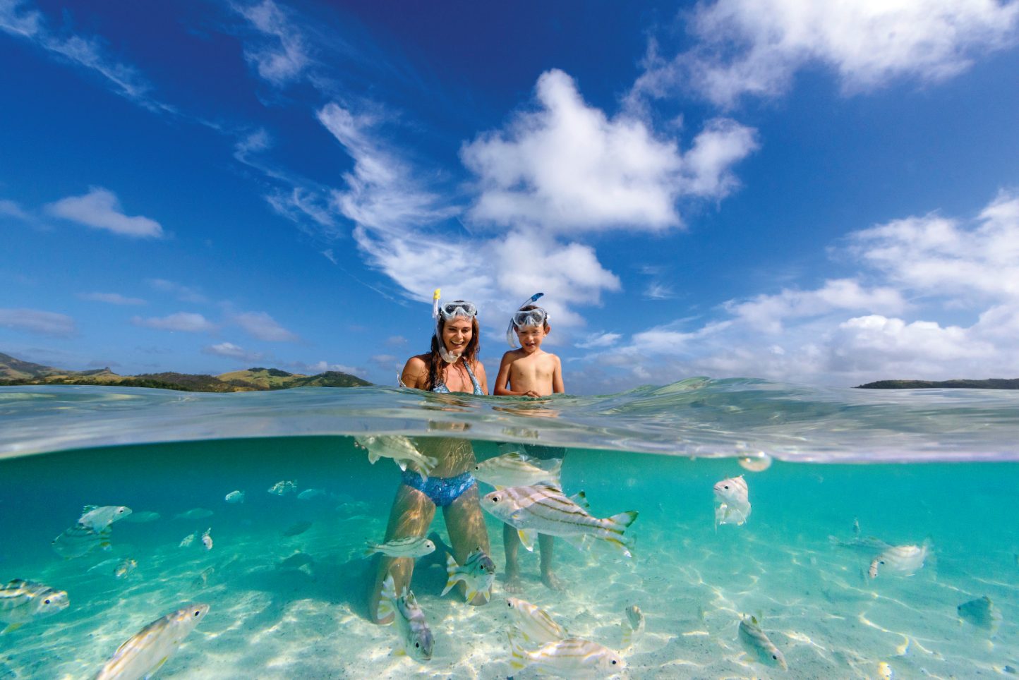 Mother and son snorkeling in Fiji